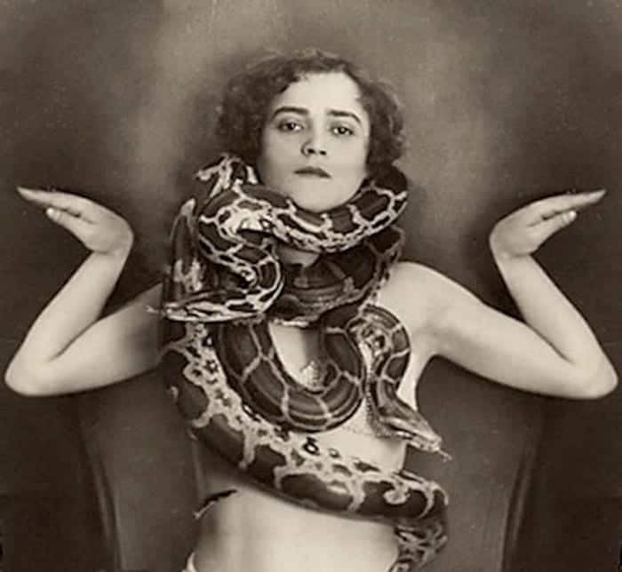 Vintage photo of a snake charmer. Snake Totem.