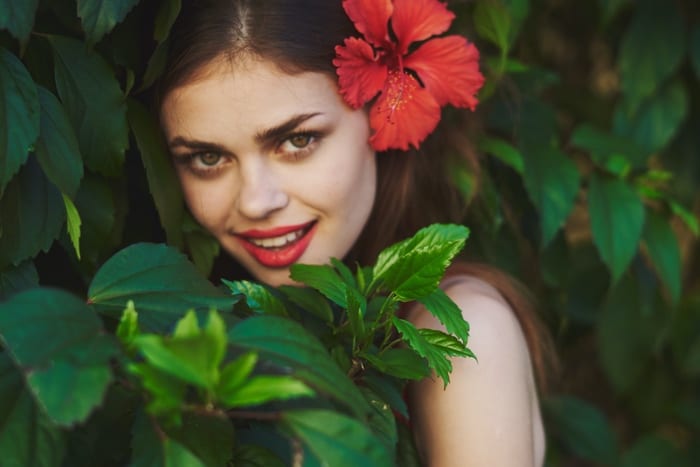Woman with Hibiscus in Hair