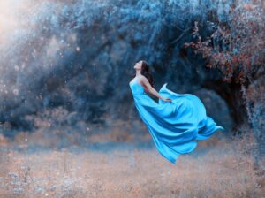 Woman Levitating in Blue Gown