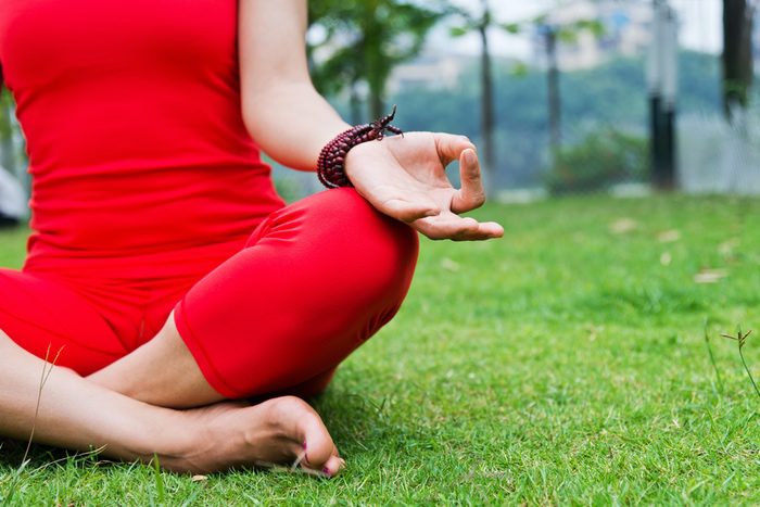 Woman Doing Yoga in Red