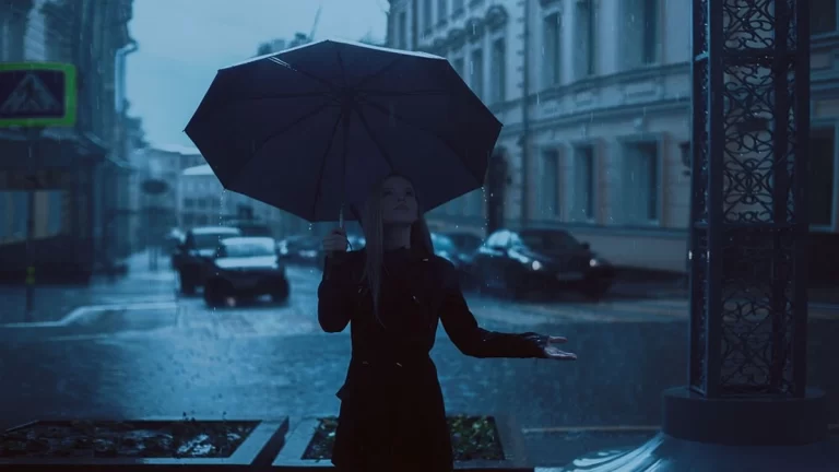 Woman with Umbrella in the Rain