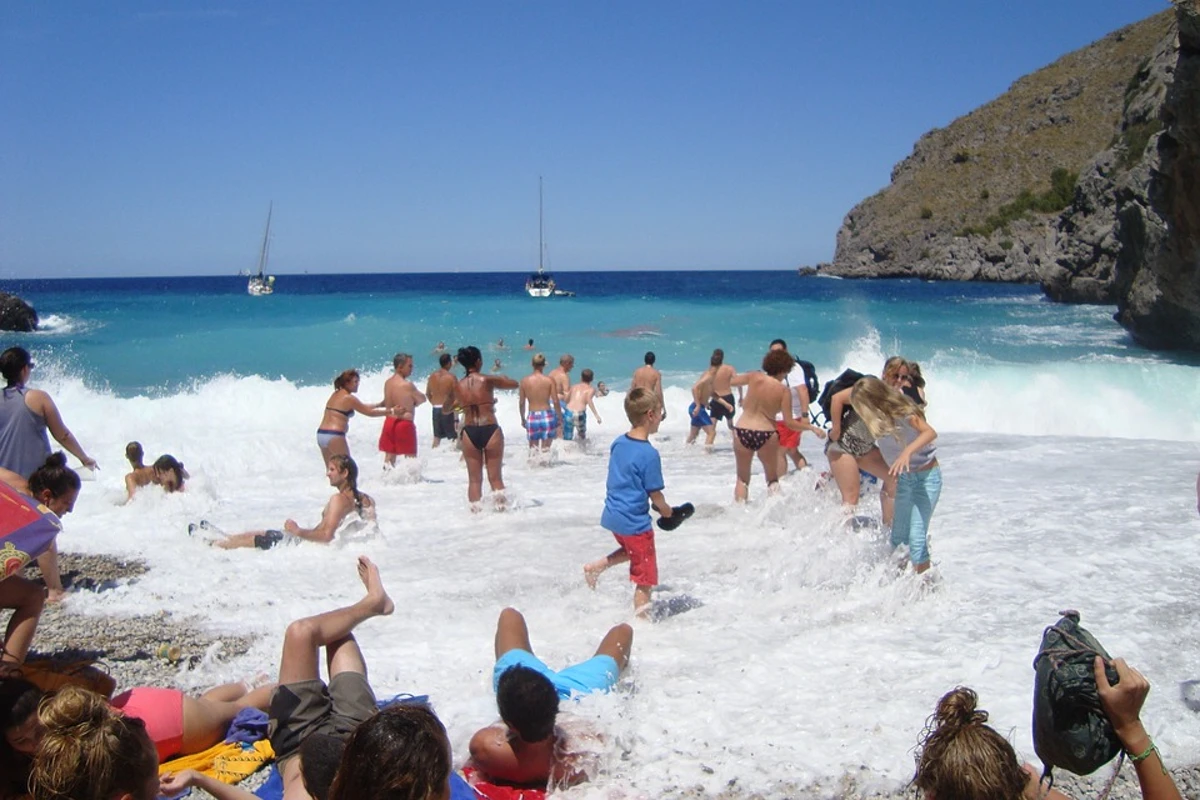 People Splashing Having Fun at the Beach